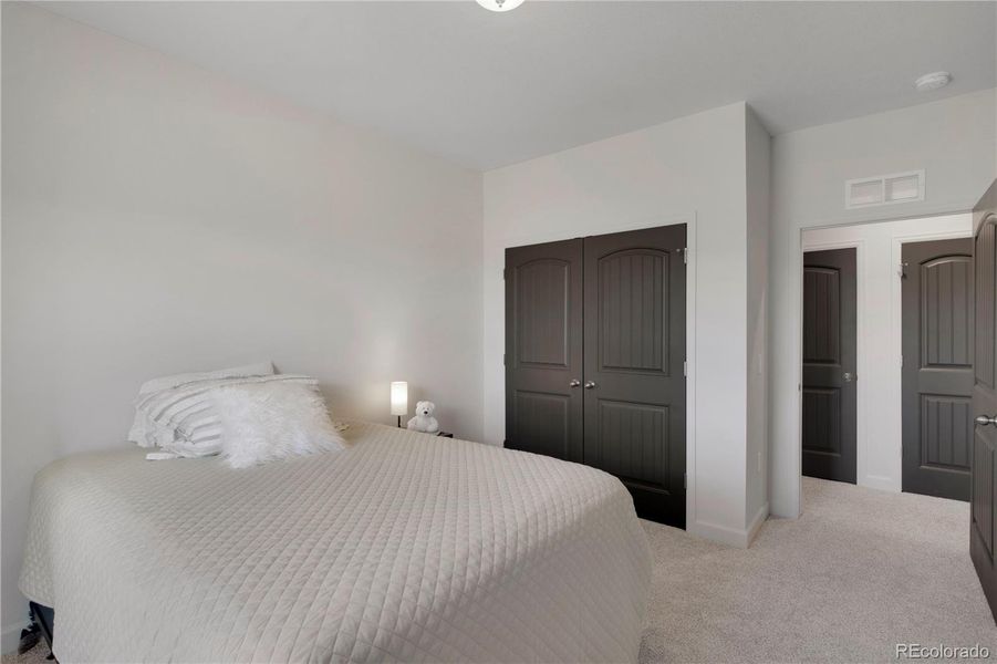 Bedroom #3 with light carpet