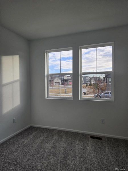 Spacious, unfurnished interior of a new home in The Cottages Collection at Ridgeline Vista, Brighton (Image 13).