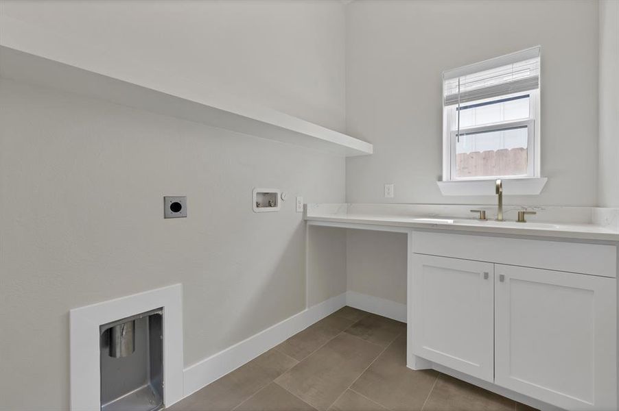 Laundry area featuring hookup for an electric dryer, baseboards, hookup for a washing machine, and cabinet space Laundry area featuring hookup for an electric dryer, baseboards, hookup for a washing machine, and cabinet space