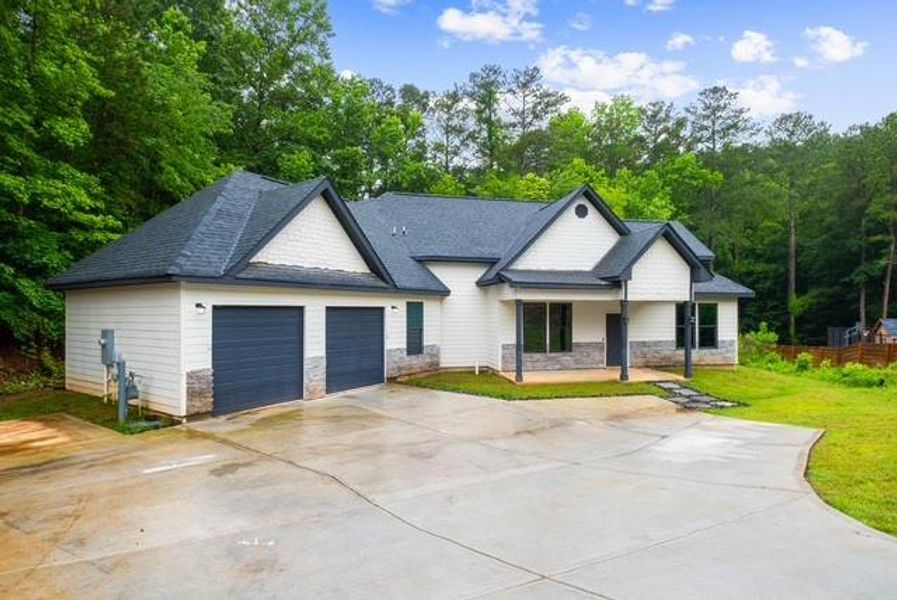 Front exterior of a new home in , Douglasville, GA, highlighting curb appeal (Image 2). Front exterior of a new home in , Douglasville, GA, highlighting curb appeal (Image 2).