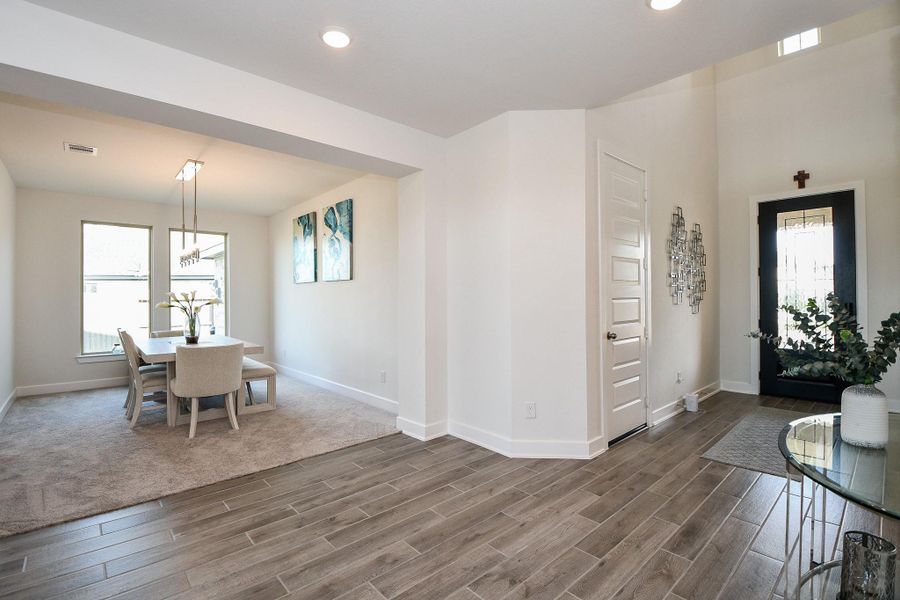 The timeless success of the open floor plan design concept gives you tremendous open, airy space, with social areas right off the main hallway, like a spacious, bright formal dining room, as seen here. The timeless success of the open floor plan design concept gives you tremendous open, airy space, with social areas right off the main hallway, like a spacious, bright formal dining room, as seen here.