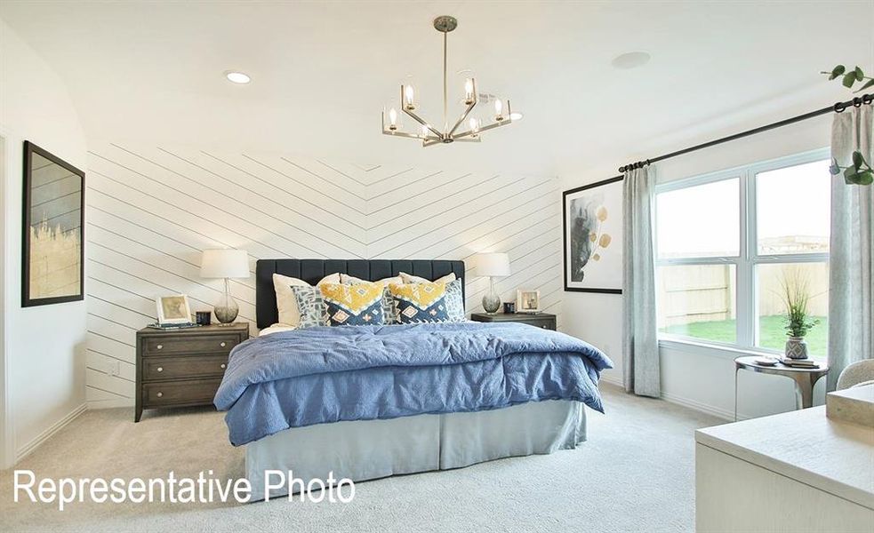 Bedroom with chevron-patterned shiplap accent wall, plush carpeting, and a multi-pane window with a black curtain rod