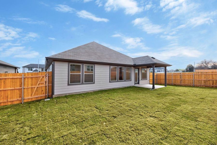 Exterior details and patio area of a home in Prairie Winds, Hutto (Image 4).