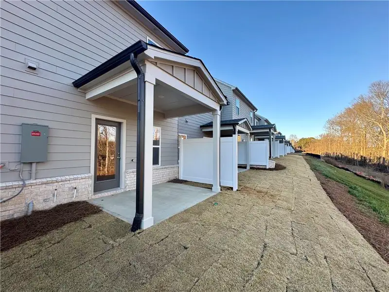 Exterior details and patio area of a home in Eastlyn Crossing, Flowery Branch (Image 4).