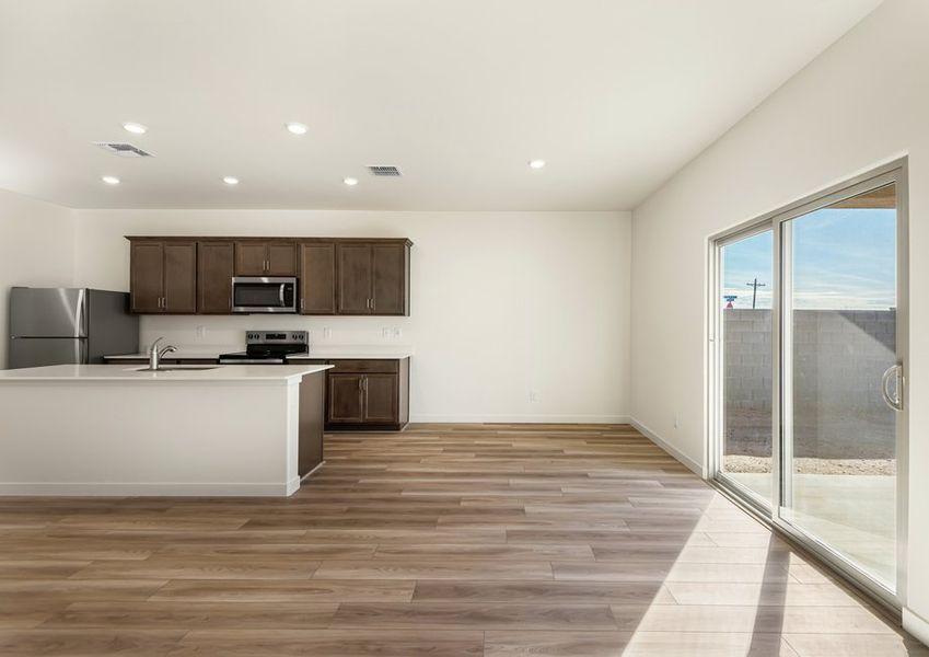 The kitchen seamlessly flows into a separate dining area. The kitchen seamlessly flows into a separate dining area.