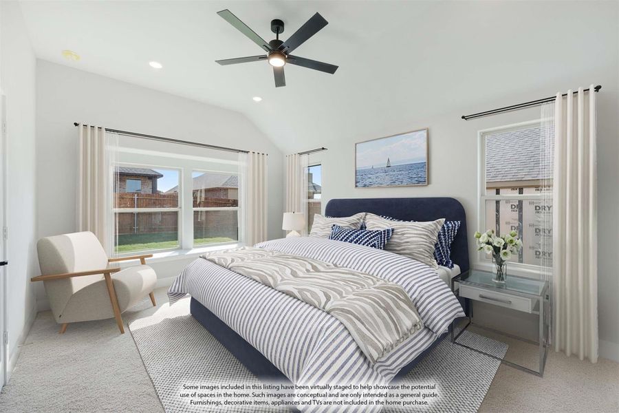 Bedroom with vaulted ceiling, ceiling fan, large windows, and navy upholstered bed on carpet