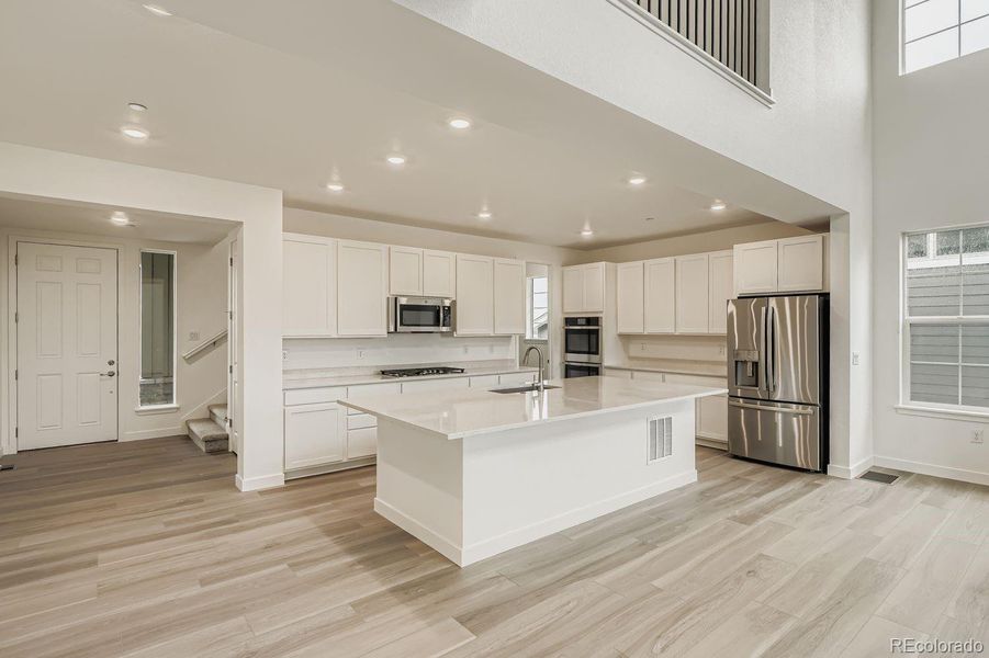 Furnished interior view inside a new home in Sunset Village: The Grand Collection, Erie (Image 5). Furnished interior view inside a new home in Sunset Village: The Grand Collection, Erie (Image 5).