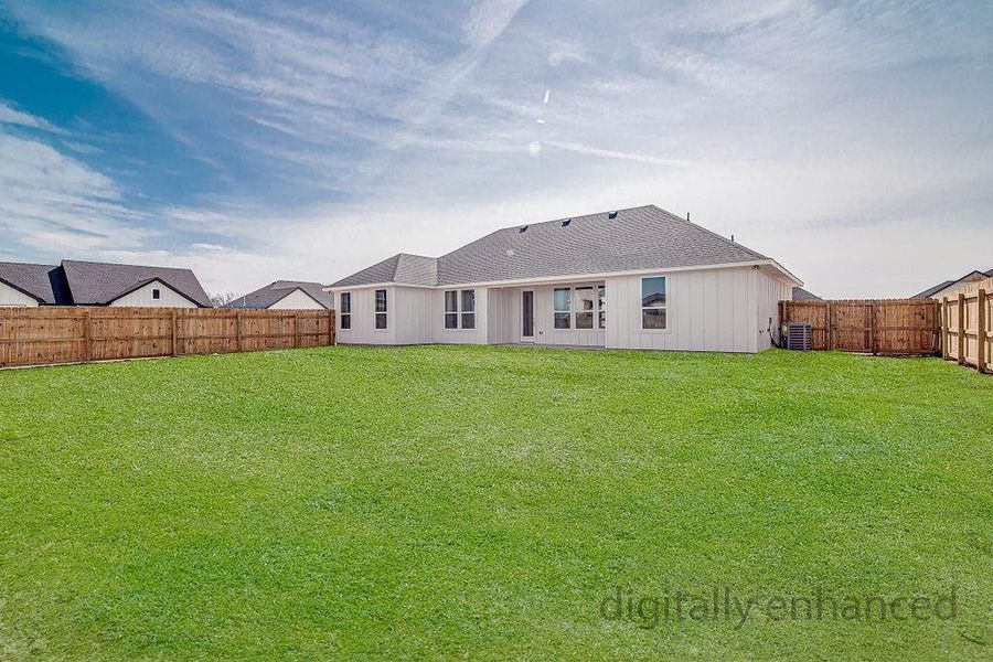 Rear view of property featuring a yard, central air condition unit, roof with shingles, and a fenced backyard