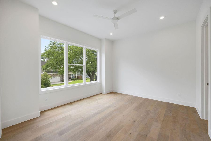 Each secondary bedroom is well-proportioned with consistent wood flooring and walk-in closets. Each secondary bedroom is well-proportioned with consistent wood flooring and walk-in closets.