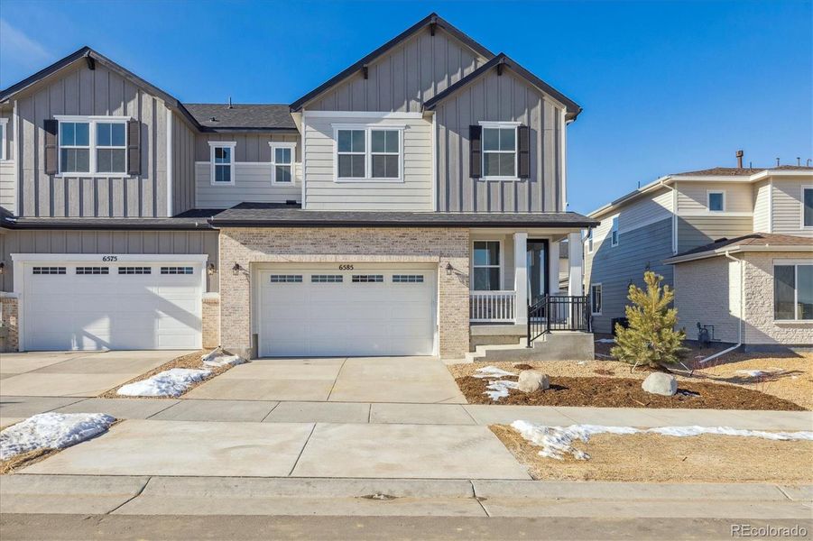 Front exterior of a new home in Skyview at High Point, Aurora, CO, highlighting curb appeal (Image 3).