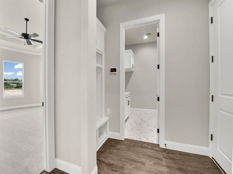 Mudroom with a ceiling fan, baseboards, and ornamental molding Mudroom with a ceiling fan, baseboards, and ornamental molding
