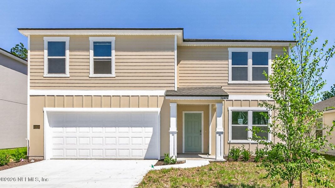 Front exterior of a new home in Copes Landing, Jacksonville, FL, highlighting curb appeal (Image 2).