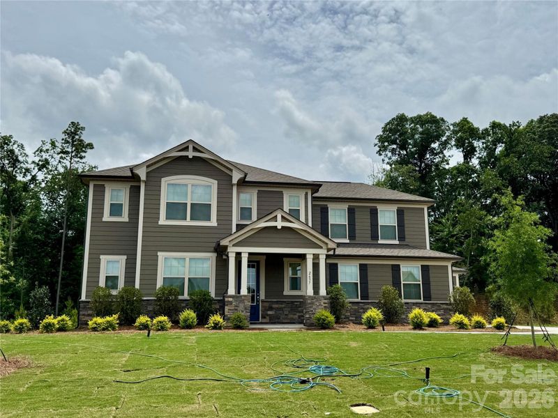 Front exterior of a new home in Blair Place, Monroe, NC, highlighting curb appeal (Image 2). Front exterior of a new home in Blair Place, Monroe, NC, highlighting curb appeal (Image 2).