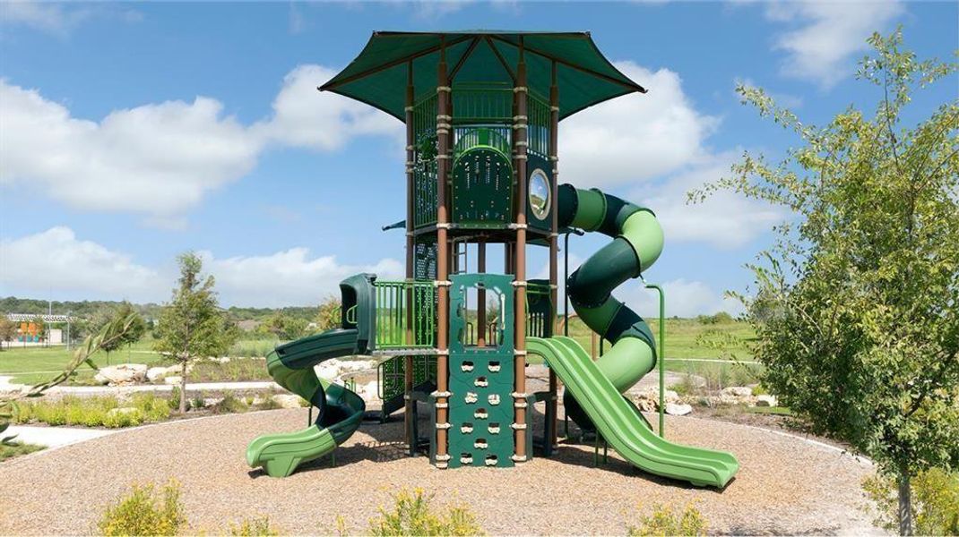 A vibrant green playground structure offers endless fun under the clear, open sky. A vibrant green playground structure offers endless fun under the clear, open sky.