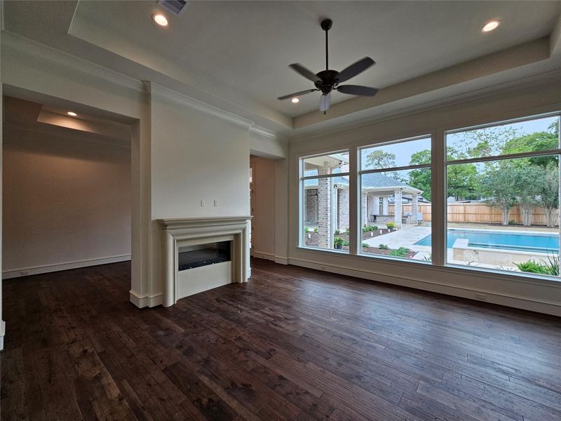 Photo Update April 2026 - Primary Bedroom with pool views and a 2-sided fireplace