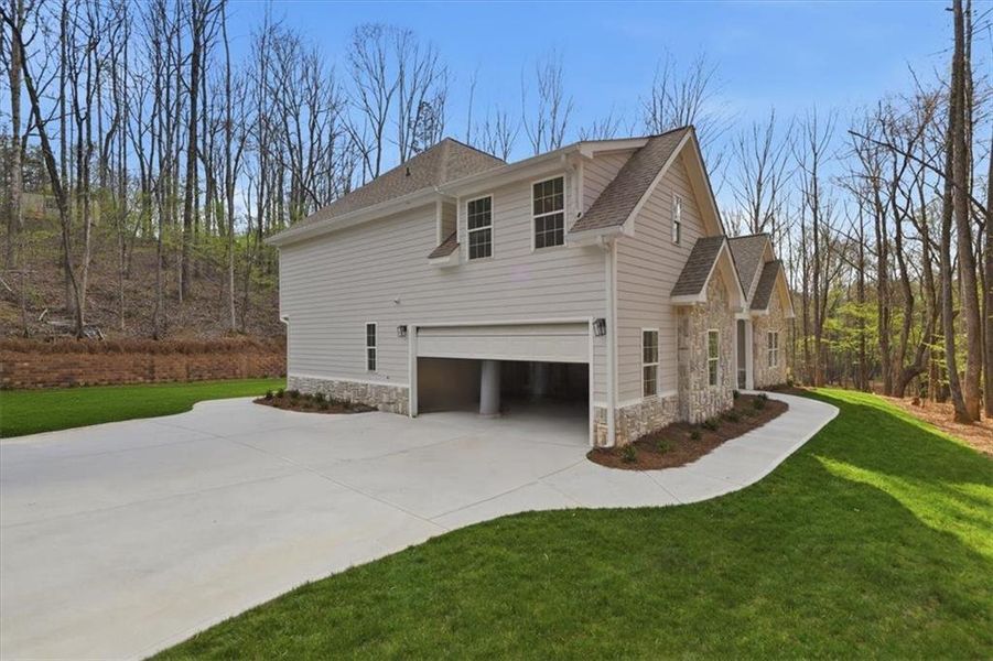 Front exterior of a new home in , Villa Rica, GA, highlighting curb appeal (Image 28). Front exterior of a new home in , Villa Rica, GA, highlighting curb appeal (Image 28).