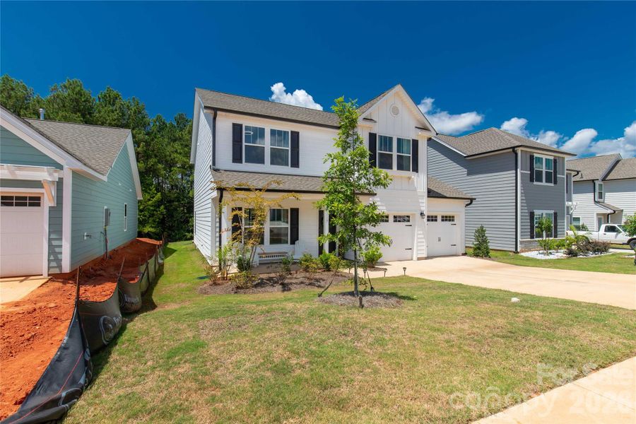 Front exterior of a new home in , Lancaster, SC, highlighting curb appeal (Image 22).