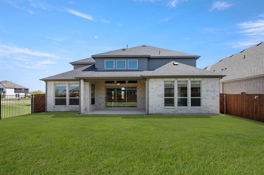 Front exterior of a new home in Birdsong, Mansfield, TX, highlighting curb appeal (Image 22).