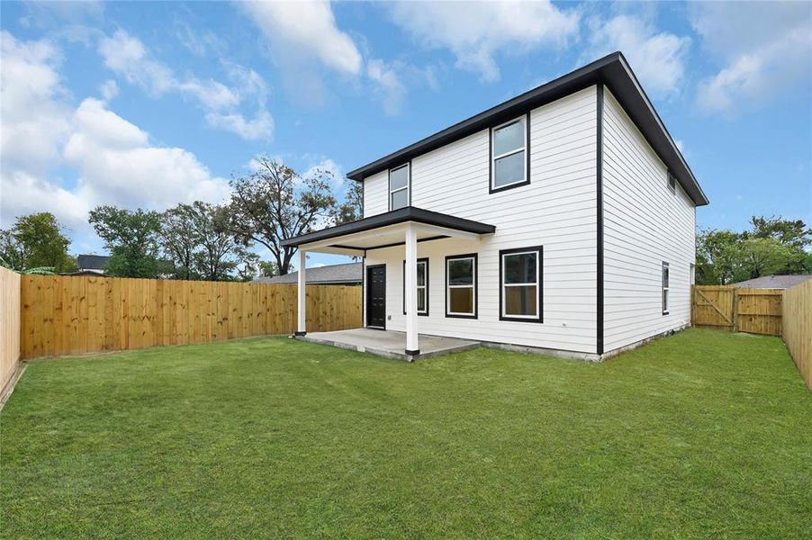 Large back yard with extended patio