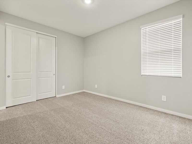 Spacious, unfurnished interior of a new home in Blossom Rock Reserve Series, Apache Junction (Image 11).