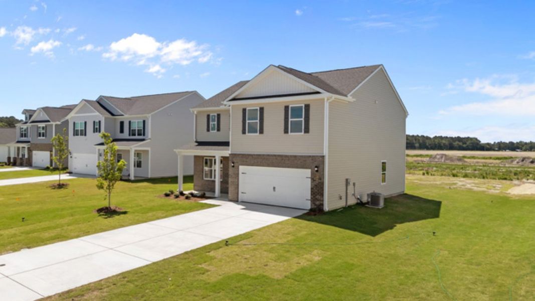 Front exterior of a new home in East Ridge, Ayden, NC, highlighting curb appeal (Image 19).