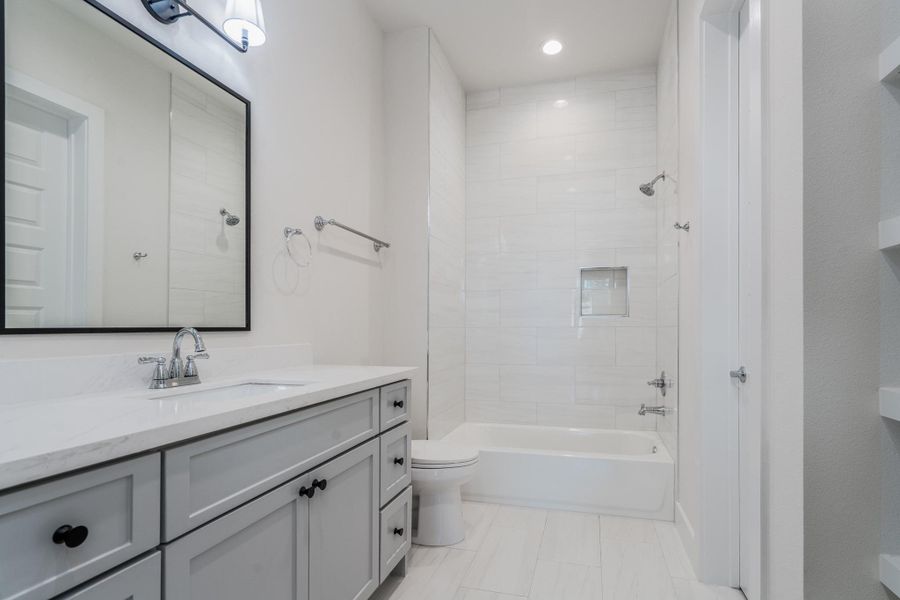 The third bedroom includes an ensuite bathroom with a shower/tub combo and large closet. The third bedroom includes an ensuite bathroom with a shower/tub combo and large closet.