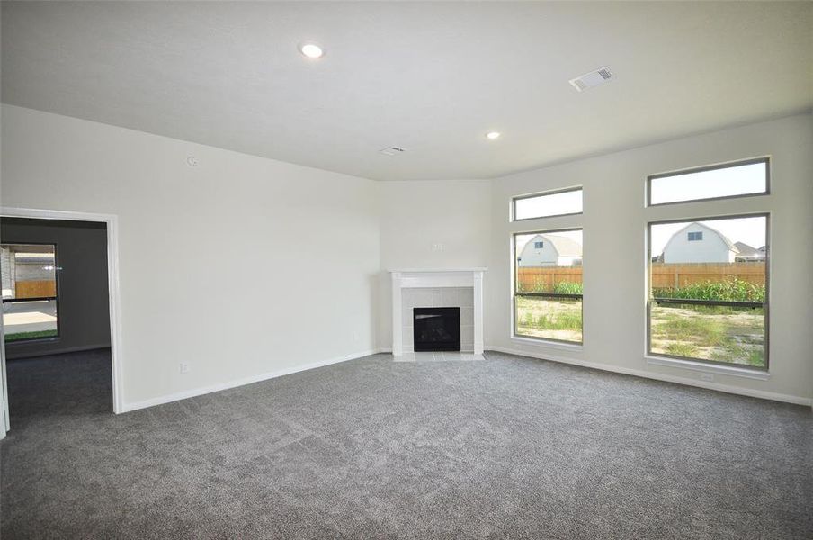 The foyer leads to a spacio0us Family Room, splashed with natural sinlight.