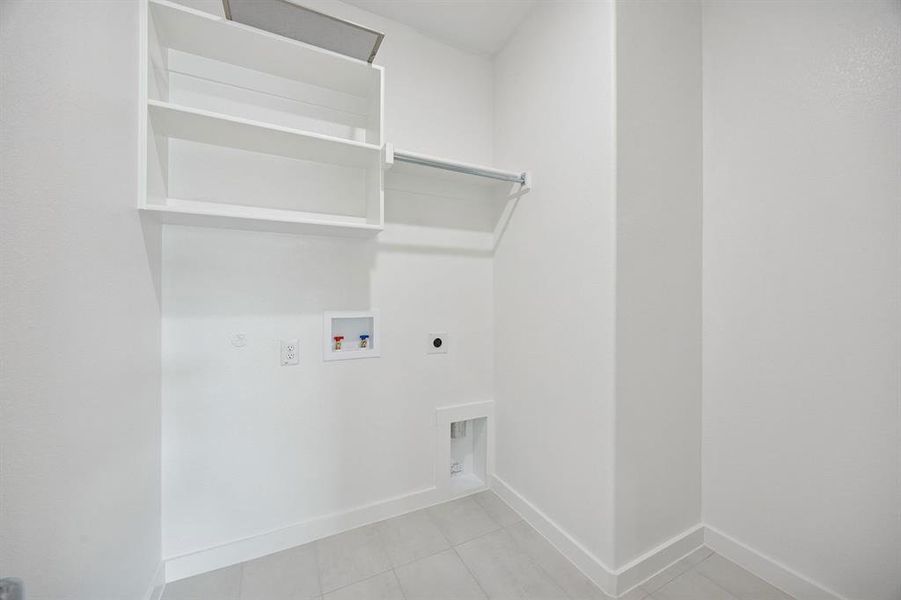 Utility Room in the Masters home plan by Trophy Signature Homes – REPRESENTATIVE PHOTO