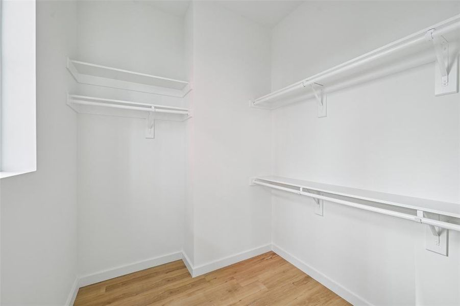 oversized walk-in closet in primary oversized walk-in closet in primary