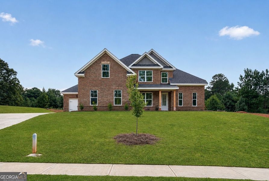 Front exterior of a new home in Patillo Manor, Stockbridge, GA, highlighting curb appeal (Image 17).