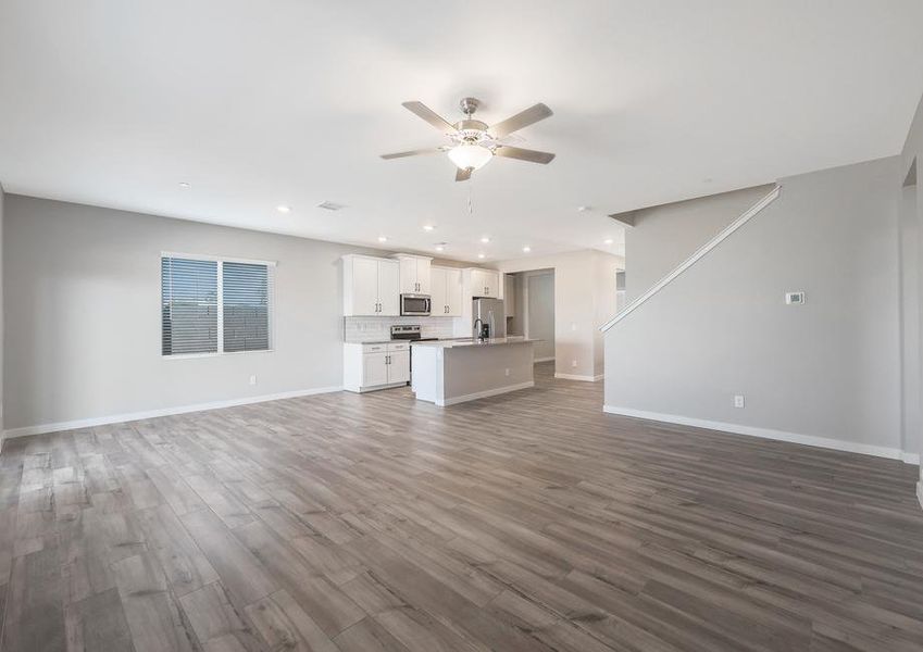 Open-concept layout, connecting the dining area, kitchen, and living room.