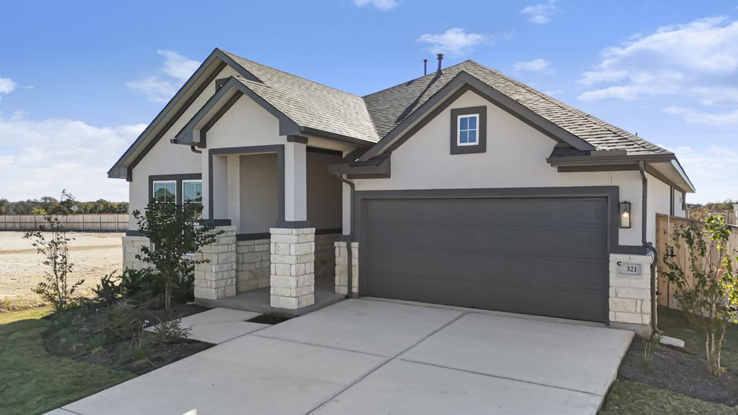 Front exterior of a new home in The Grove at Blackhawk, Pflugerville, TX, highlighting curb appeal (Image 30). Front exterior of a new home in The Grove at Blackhawk, Pflugerville, TX, highlighting curb appeal (Image 30).