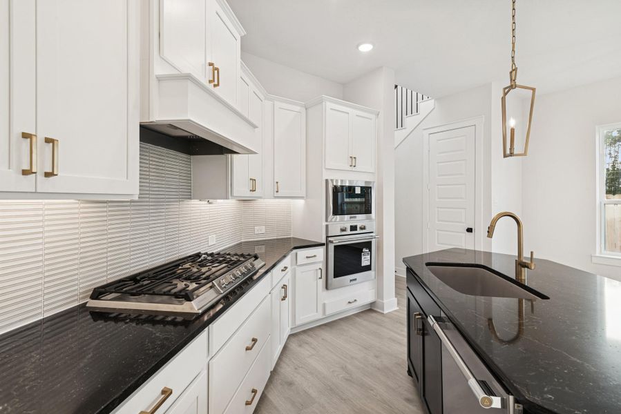 Furnished interior view inside a new home in The Highlands - Grove Collection, Porter (Image 6).