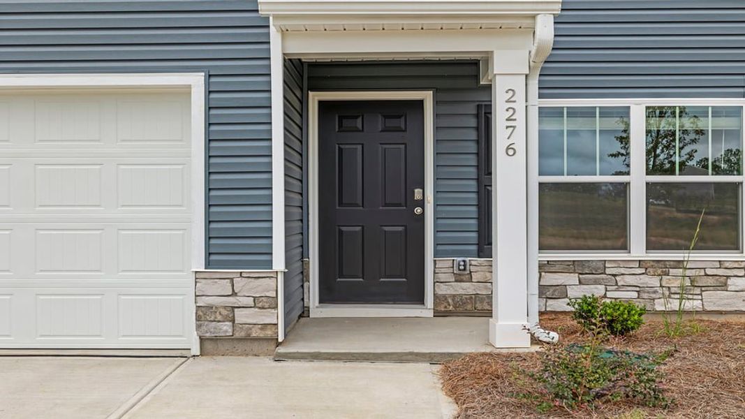 Exterior details and patio area of a home in Lakestone, Woodruff (Image 3).