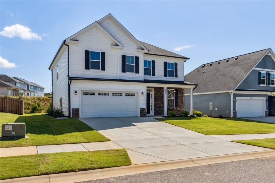 Front exterior of a new home in Windsor, North Augusta, SC, highlighting curb appeal (Image 17). Front exterior of a new home in Windsor, North Augusta, SC, highlighting curb appeal (Image 17).