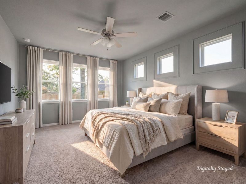Spacious primary bedroom with plush carpet, a ceiling fan, and a wall of windows topped by transom-style accents for added light. Soft, neutral tones create a calm and restful retreat. This photo has been digitally staged to illustrate the possibilities of the home's aesthetic and potential design. Some furnishings and décor shown are for visual inspiration.