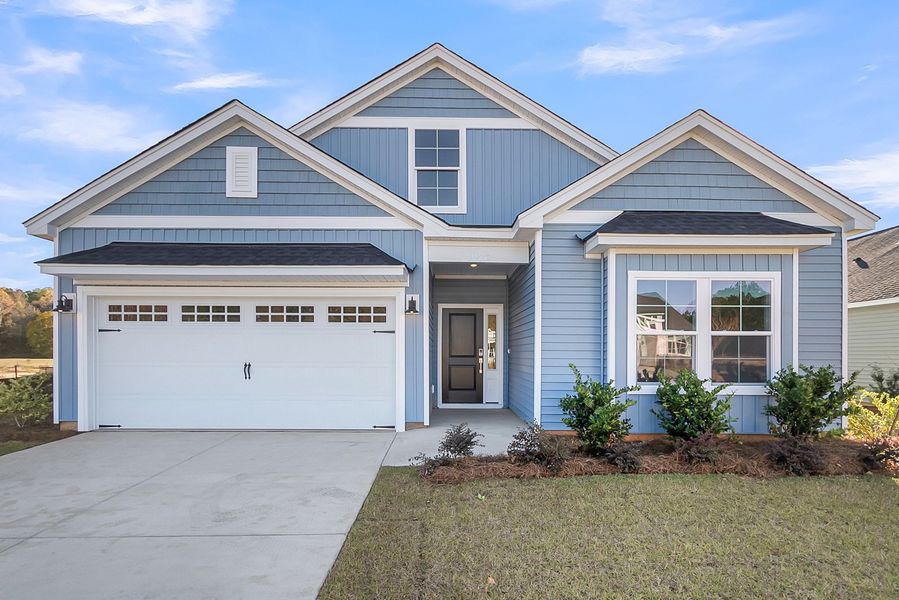 Front exterior of a new home in Fairway Woods at Wyboo, Manning, SC, highlighting curb appeal (Image 1).