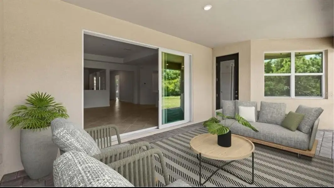 Exterior details and patio area of a home in Island Lakes at Coco Bay: Executive Homes, Englewood (Image 4). Exterior details and patio area of a home in Island Lakes at Coco Bay: Executive Homes, Englewood (Image 4).