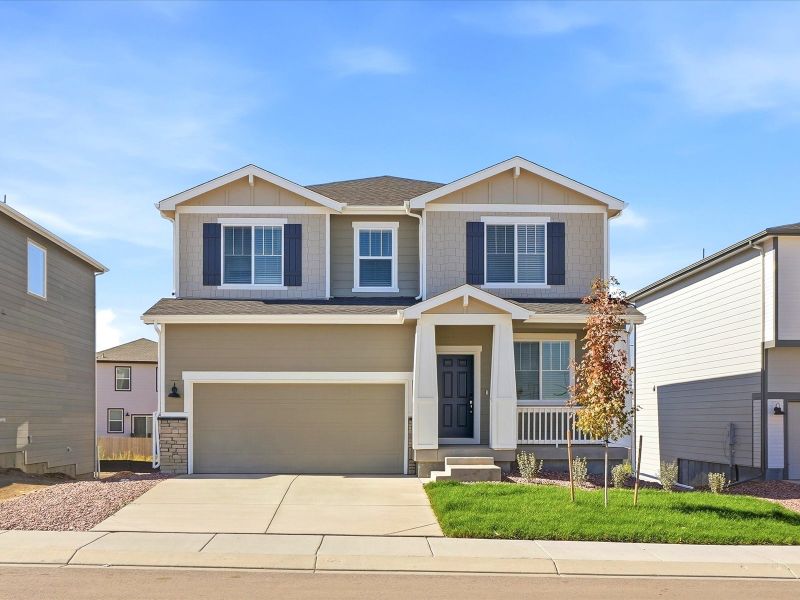 Front exterior of a new home in Lorson Ranch : The Springs Collection, Colorado Springs, CO, highlighting curb appeal (Image 1). Front exterior of a new home in Lorson Ranch : The Springs Collection, Colorado Springs, CO, highlighting curb appeal (Image 1).