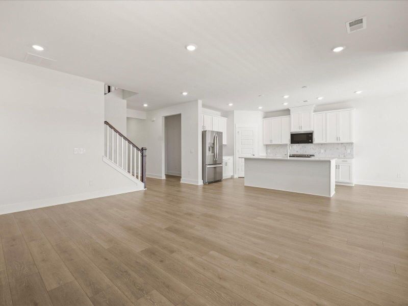 Spacious, unfurnished interior of a new home in The Coves at Lakes of Cane Bay II, Summerville (Image 29).