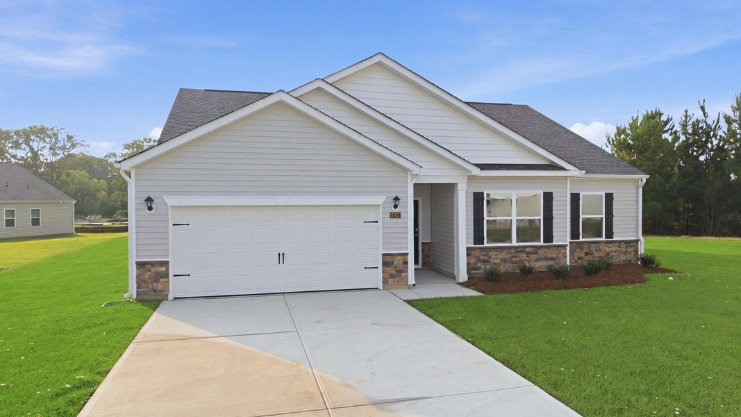 Front exterior of a new home in Villa Grande, Winterville, NC, highlighting curb appeal (Image 2). Front exterior of a new home in Villa Grande, Winterville, NC, highlighting curb appeal (Image 2).