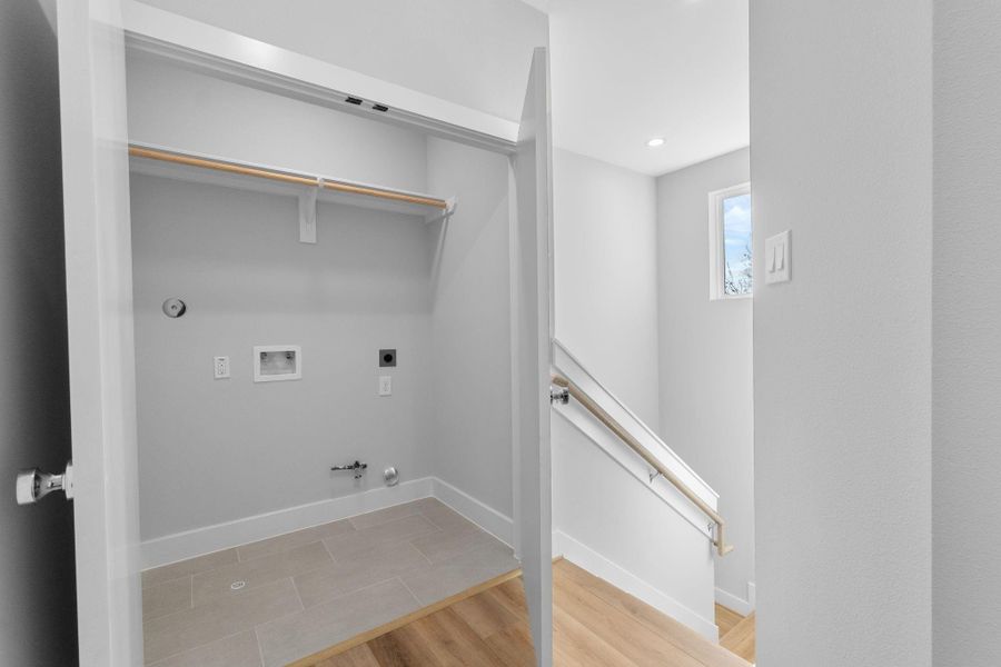 Convenient utility room with washer and dryer connections and additional storage space, designed for everyday functionality on the 3rd floor.