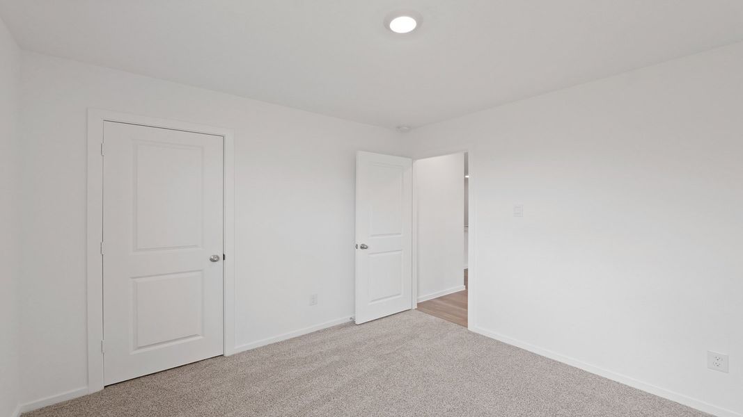 Representative unfurnished interior of a home built from the Estero by D.R. Horton in Lake Conroe Cove, Willis (Image 25). Representative unfurnished interior of a home built from the Estero by D.R. Horton in Lake Conroe Cove, Willis (Image 25).