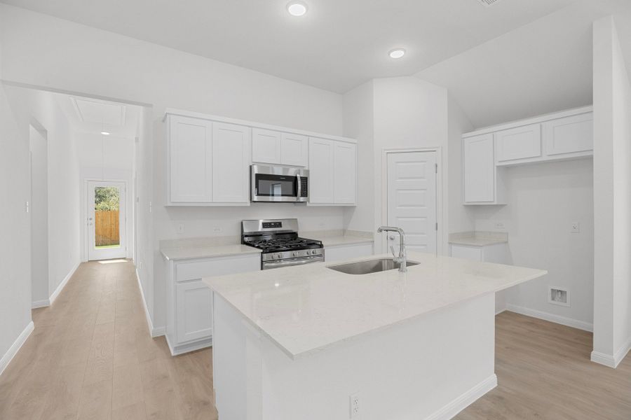 Kitchen in the Cypress home plan by Trophy Signature Homes - REPRESENTATIVE PHOTO