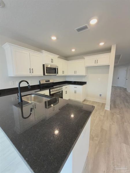 Furnished interior view inside a new home in Allison Acres, Cantonment (Image 7).