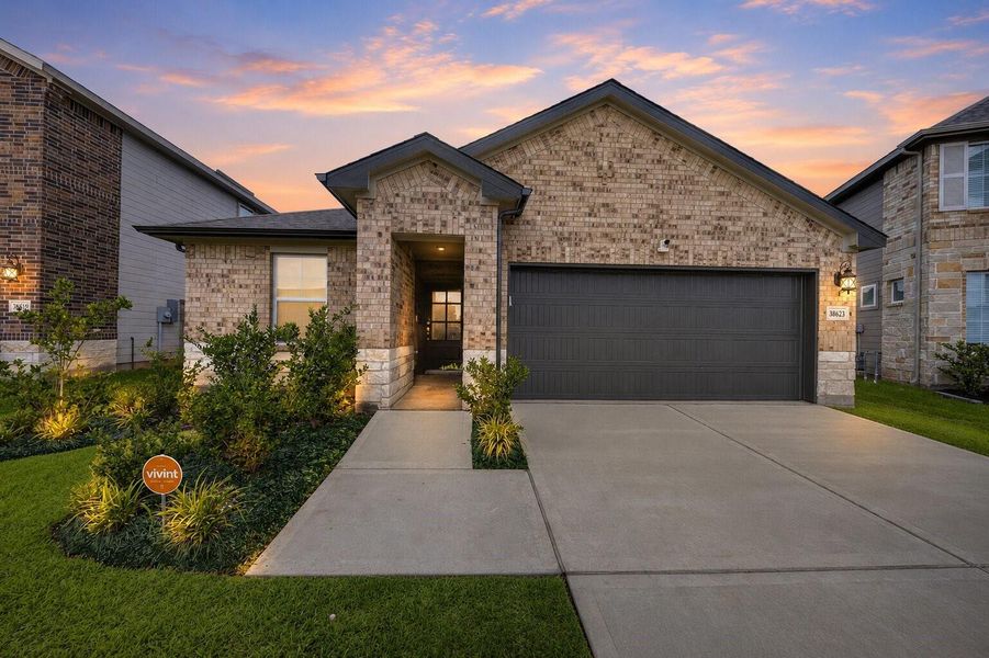 Front exterior of a new home in Magnolia Place, Magnolia, TX, highlighting curb appeal (Image 21). Front exterior of a new home in Magnolia Place, Magnolia, TX, highlighting curb appeal (Image 21).