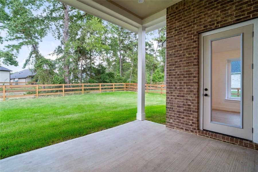 Exterior details and patio area of a home in Timber Hollow, Magnolia (Image 4).
