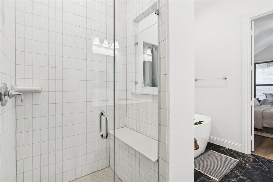 Full bathroom featuring ensuite bathroom, a shower stall, and a freestanding tub Full bathroom featuring ensuite bathroom, a shower stall, and a freestanding tub