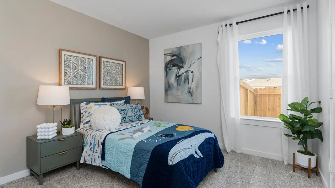 Furnished interior view inside a new home in Caldwell Crossing, Iowa Colony (Image 11).