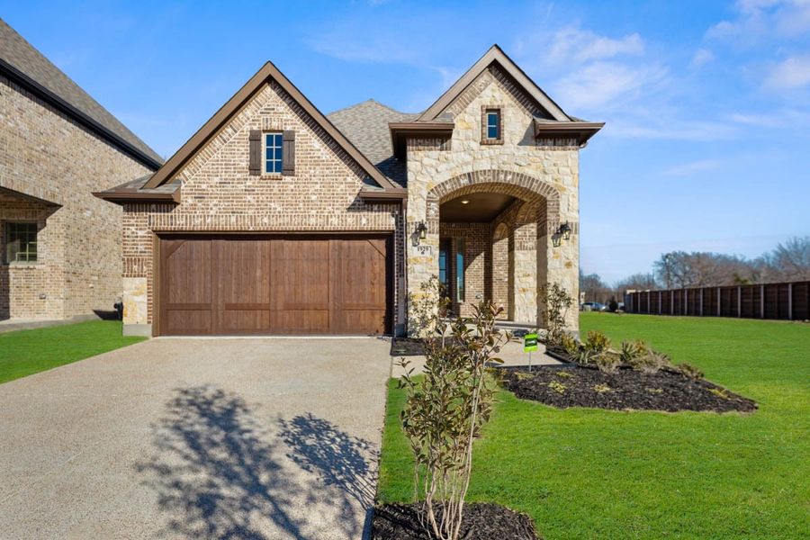 Front exterior of a new home in Avondale, Fate, TX, highlighting curb appeal (Image 18).